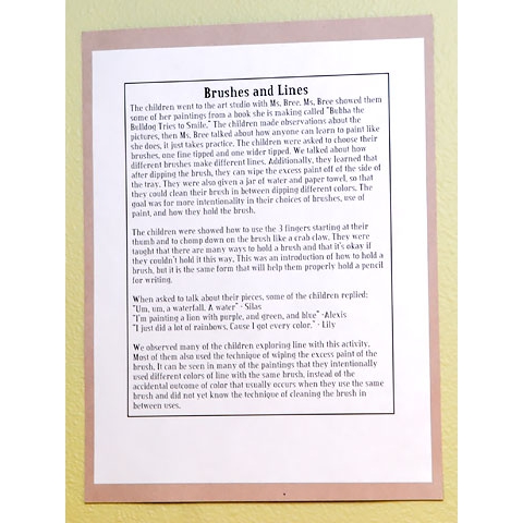 Description of children’s art displayed on wall