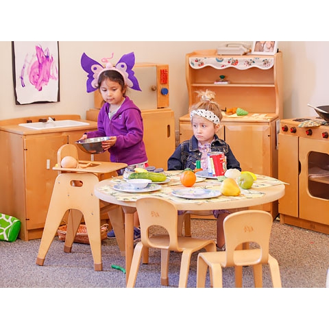 Two children playing in house area