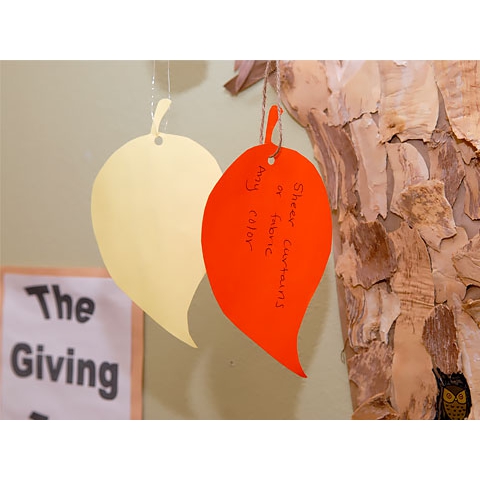 Red leaf from Giving Tree with material request written on it