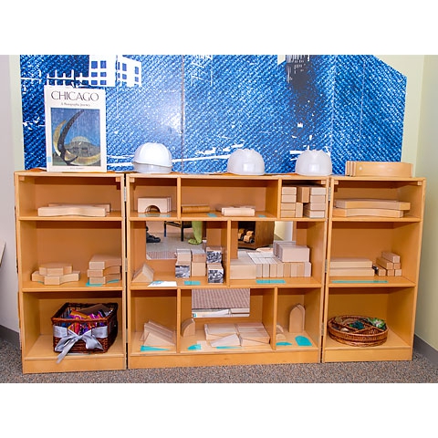 Floor shelving with blocks organized neatly in cubby holes