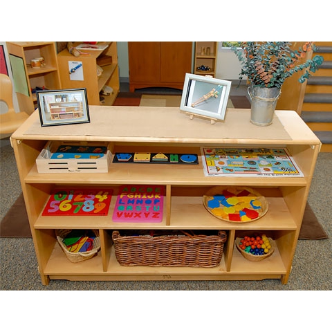 Puzzles arranged on floor shelving