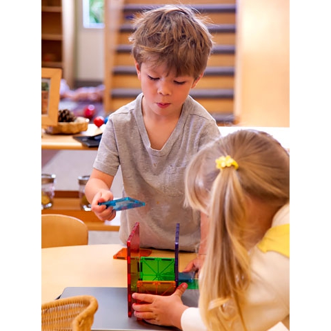 Children working together on manipulatives