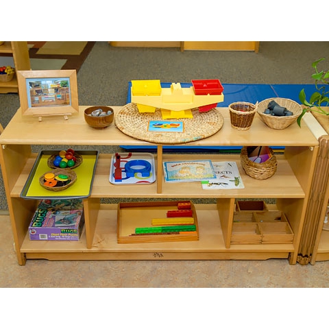 Science manipulatives displayed on floor shelving