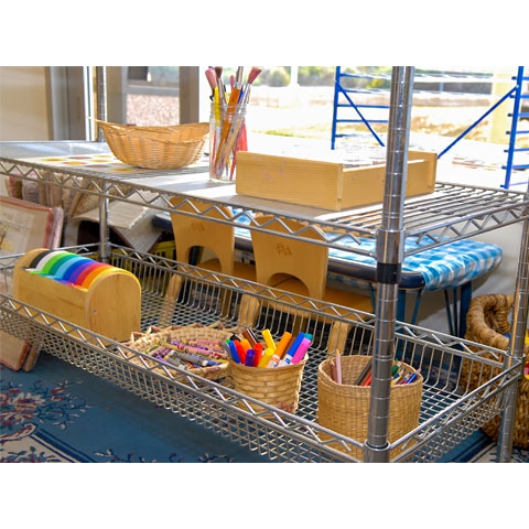 Art supplies displayed in metal shelving