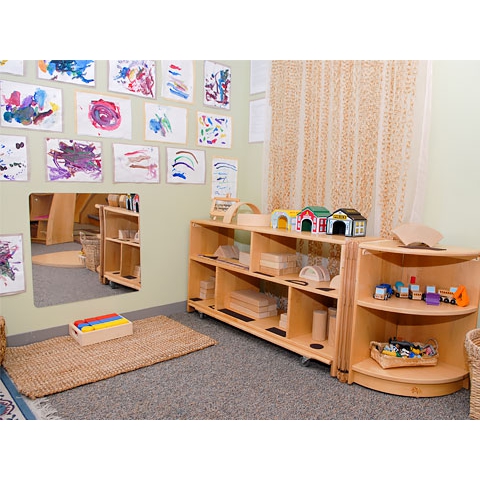 Block area with mirror and children’s art on wall