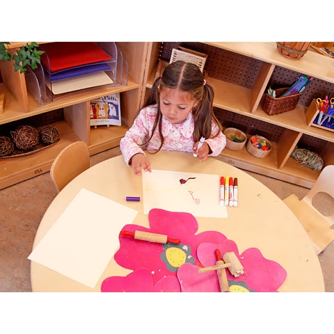 Child drawing in art area