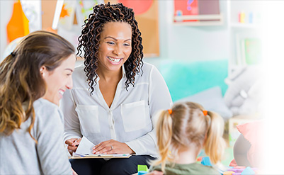 A child, her parent and her teacher